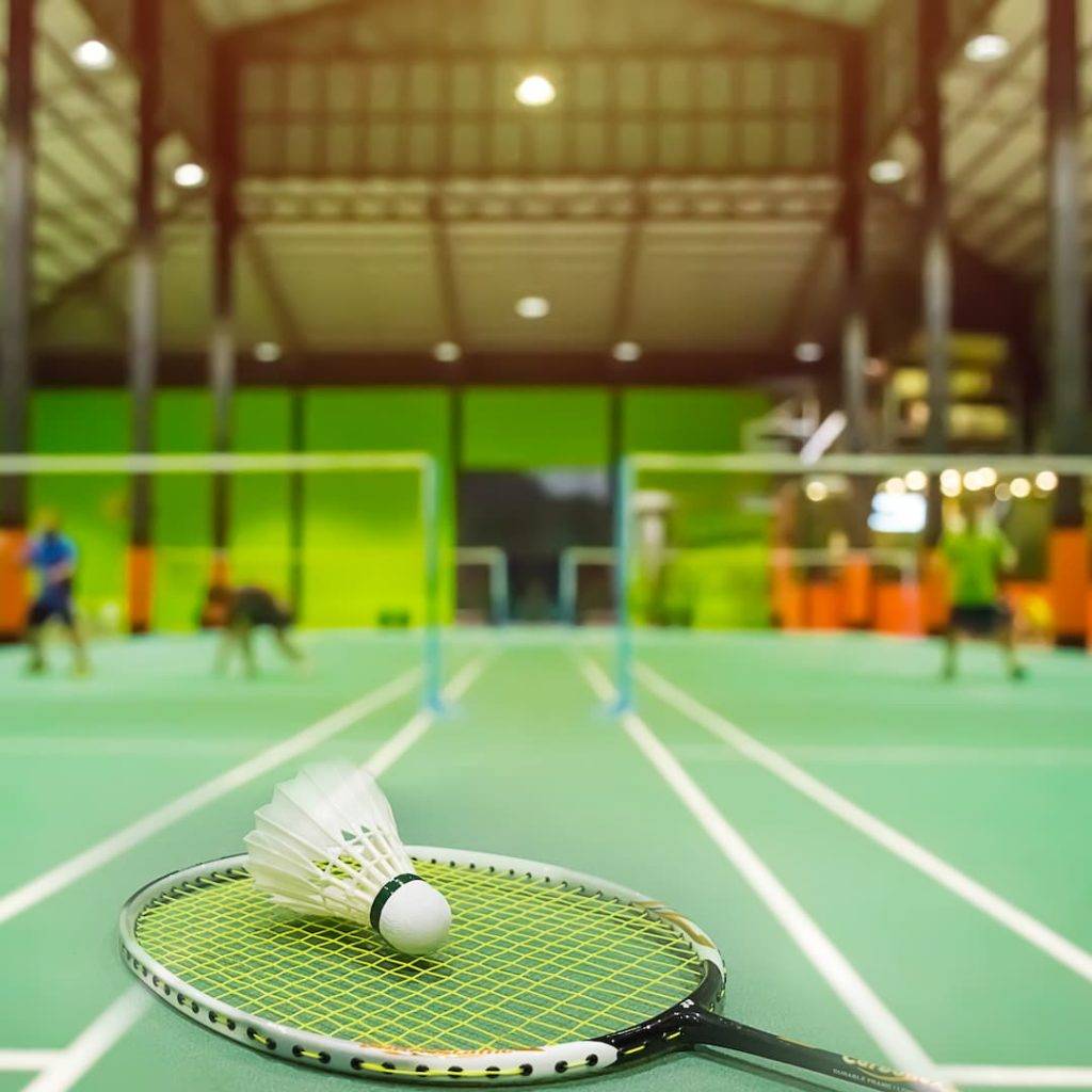 Badminton Courts With Shuttlecocks In The Foreground